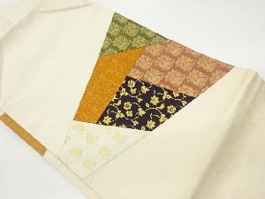 切り嵌め角倉文に荒波文・花唐草模様織出し名古屋帯